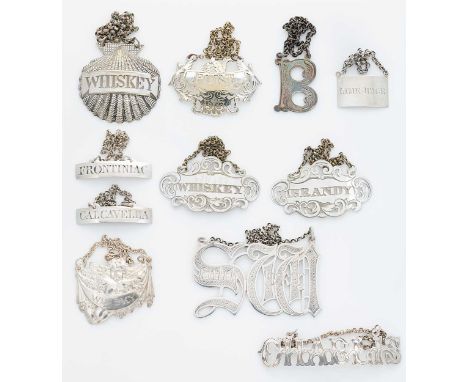 A collection of eleven 19th century and later bottle labels, all apparently unmarked but tested as silver, including two unus