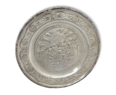 A William IV silver decorative plate, mark of Benjamin Smith III, London 1835, of circular dished form, gadrooned rim, repous
