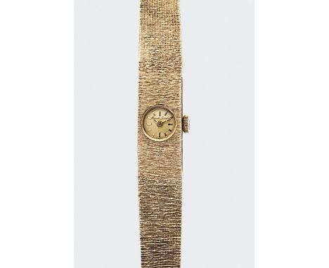 Roy King for Bueche-Girod - A 9ct gold wristwatch, circa 1972, circular champagne dial with gold coloured batons and hands, 1