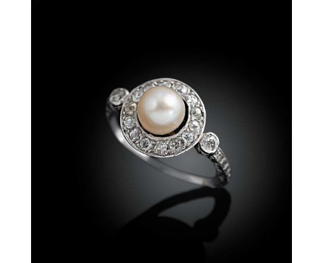 An Art Deco pearl and diamond target ring, central pearl (untested), approximate diameter 5.7mm, surrounded by old brilliant 