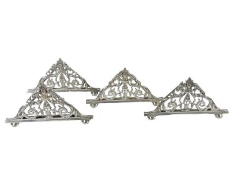 A set of 4 Victorian silver menu holders, mark of William Hutton &amp; Sons (Edward Hutton), London 1890, each of triangular 