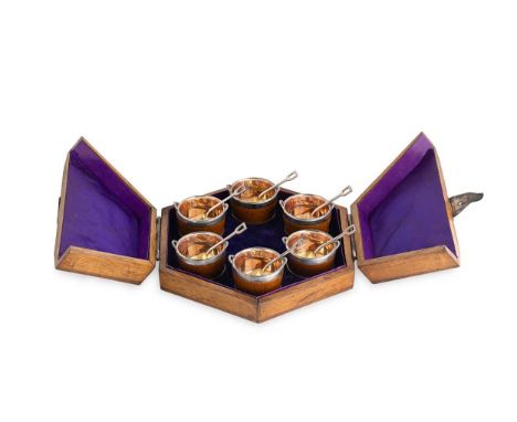 A cased set of six silver plated and oak butter bowls and spoons, probably 19th century, each in the form of a coopered woode