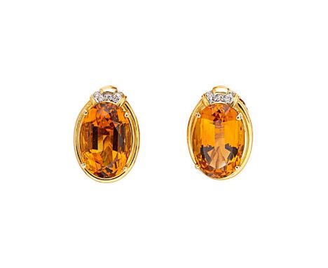 A pair of citrine and diamond ear studs, each with a claw set oval faceted citrine, approximately 18 x 12mm, further set with