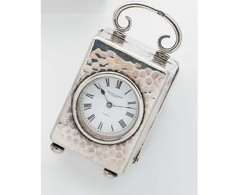 An early 20th century silver boudoir clock, mark of Mappin &amp; Webb, London 1906, of rectangular form and hammered finish, 
