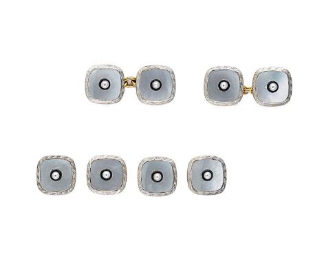 A pair of early 20th century cufflinks, together with matching shirt studs, the cufflinks, each with a yellow and white cushi