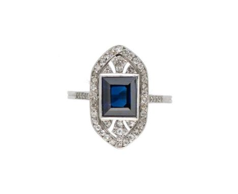 An Art Deco sapphire and diamond ring, rubover set rectangular faceted sapphire, approximately 7.9 x 6.7 x 4.2mm, estimated a