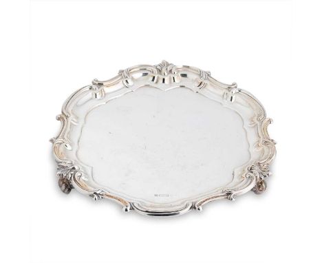 An Edward VII silver salver, mark of Fenton Brothers Ltd., Sheffield 1905, of circular form with shell and scroll rim, raised
