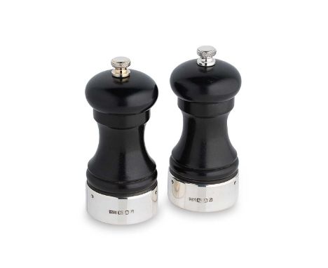 A pair of Elizabeth II silver pepper grinders, mark of Mappin &amp; Webb, London 1985, each of traditional capstan form, wood