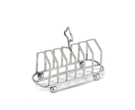 An Edward VII silver 7 bar toast rack, mark of Mappin &amp; Webb, Sheffield 1907, of unusually heavy gauge, Gothic arched bar