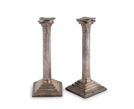 A pair of George V silver candlesticks, mark of Willian Hutton &amp; Sons, Sheffield 1911, each square, stepped and loaded ba