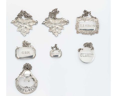 A collection of 7 George III and later silver bottle labels by notable silversmiths, first, a matching pair, mark of George U