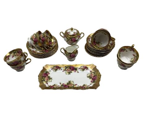 Royal Chelsea Golden Rose pattern tea set comprising eight cups and saucers, eight tea plates, milk jug, sugar bowl and cover