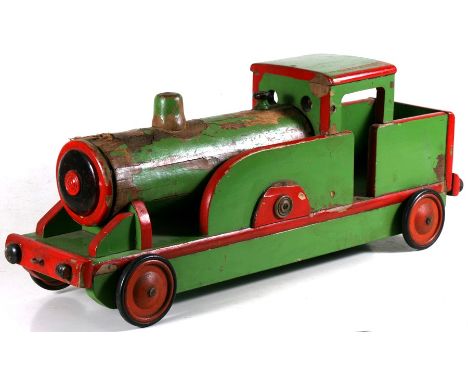A vintage painted wooden pull-along locomotive, 82cms  (32.25ins) long.