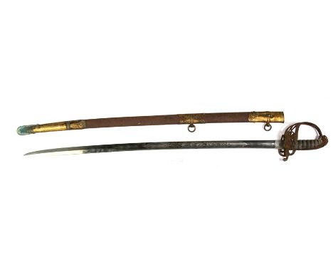 A Victorian officer's dress sword with VR cypher on both the blade and folding knuckle guard with sharkskin grip and brass mo