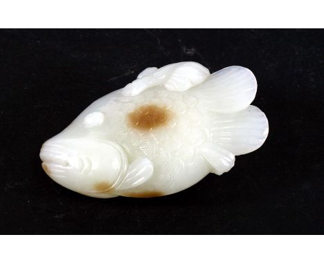 A Chinese jade carving in the form of a fish, 7cms (2.75ins) long.