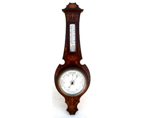An Edwardian inlaid mahogany wall mounted aneroid barometer thermometer. 77cm (30.25 ins) high