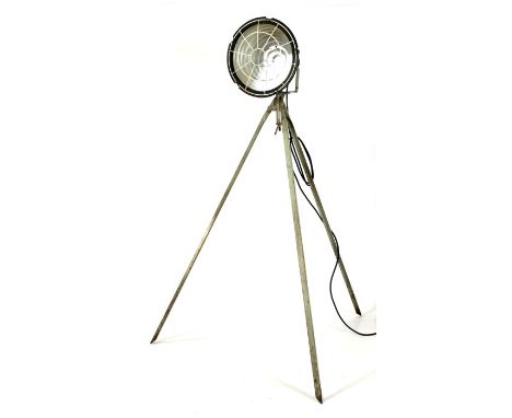 A German design vintage industrial spotlight on steel tripod stand, approx 188cms (74ins) high.