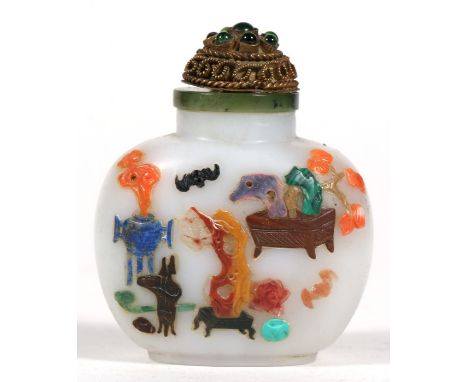 A Chinese jade snuff bottle with coral and hardstone inlay depicting precious objects, flowers and a bat 6.5cm (2.5ins) high 