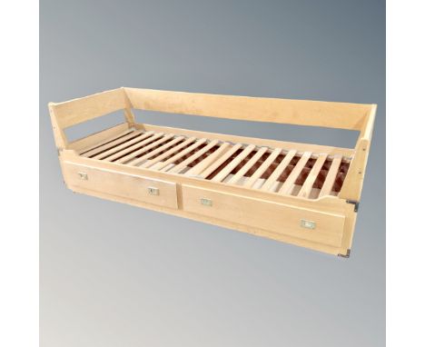 A light oak 20th century day bed fitted with drawers  