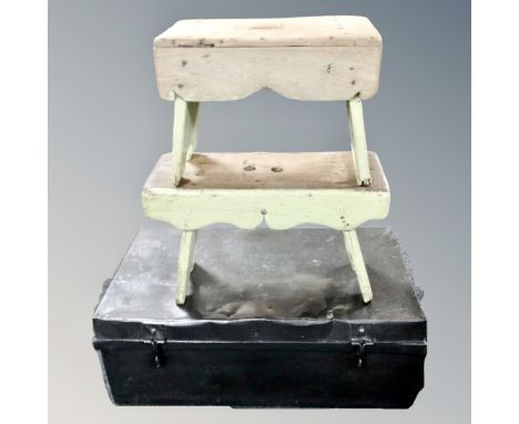 A vintage tin trunk together with two painted pine crackets. 