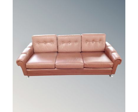 A light tan continental three seater button settee with a pair of matching armchairs  