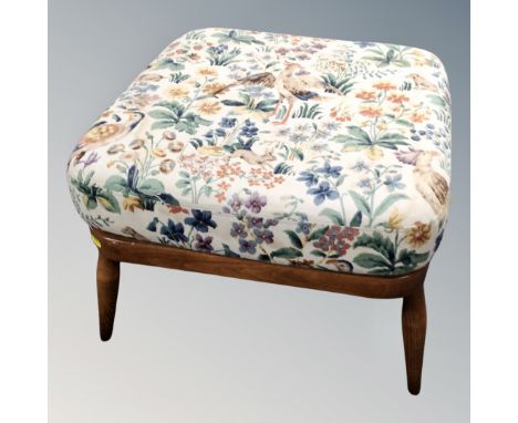 An Ercol footstool with cushion 