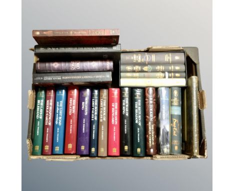 A box of hard backed J R R Tolkien volumes including The Lord of the Rings etc to include a Harper Collins four-book box set.