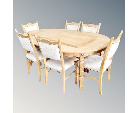 A 20th century light oak extending table with leaf and six chairs 