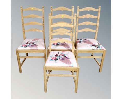 A set of four pine ladder backed chairs 