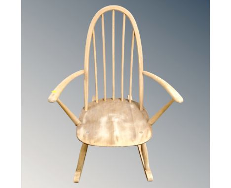 An Ercol white elm rocking chair 