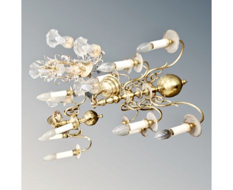 A continental brass eight-way light fitting together with a further box containing two brass light fittings one with glass dr