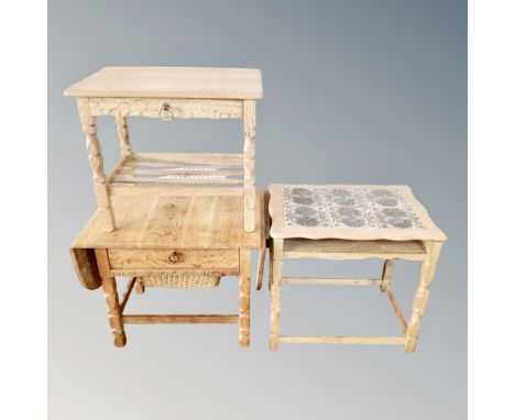 A light oak occasional table fitted a drawer and two further pieces of light oak furniture 