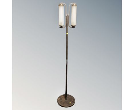 A contemporary metal and glass floor light 