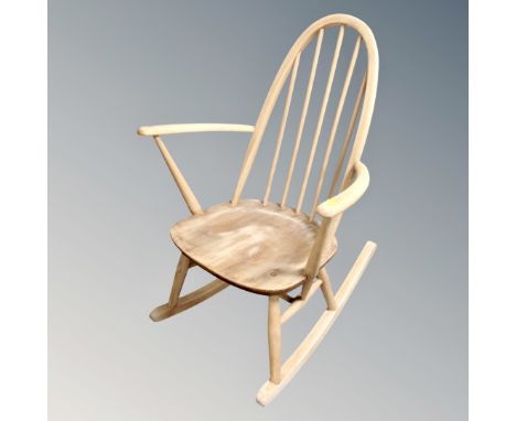 An Ercol white elm rocking chair 