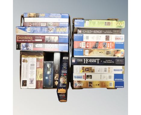Two boxes containing a quantity of jigsaws relating to Lord of the Rings, Harry Potter. 