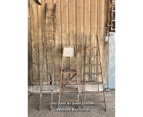 3 ladders. 2 wooden step ladders and a timber straight ladder 294cm tall 