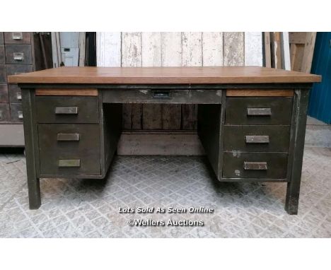 A vintage metal knee hole desk with later oak top. 157cm W x 76cm H x 89cm D. Some marks, ex shop display 