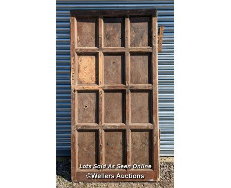 Very large pine Castle door. Pine paneled face with oak back panel. Large cast iron hinges. Size 111cm x 222cm x 7cm 