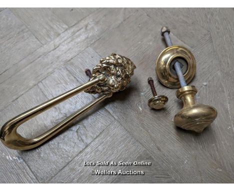 A brass lions head swag door knocker and brass doorpull. Both quality reproductions. Knocker is 23cm long. The pull is 8cm di