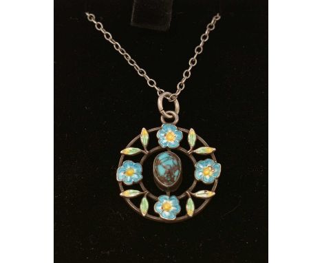 An Edwardian turquoise, enamel and silver pendant, stamped 'Sterling', on silver chain.