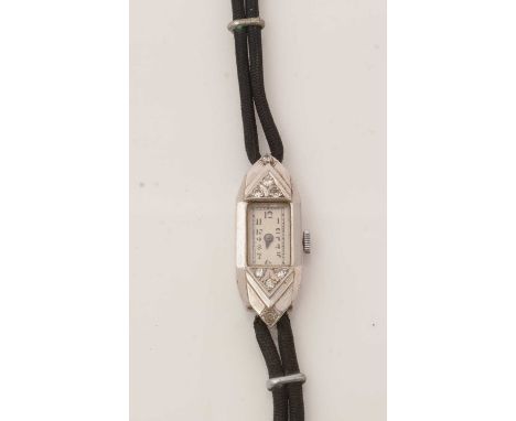 A diamond set platinum cased cocktail watch, the arabic dial fitted manual wind movement, on cord strap.