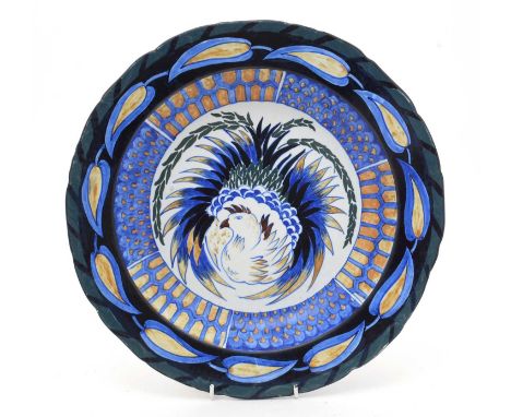 A large Cauldon art pottery dish, probably designed by Frederick Rhead, with a central stylised phoenix, scale and leaf borde