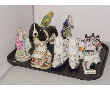A selection of decorative ceramic animals and figures, including: a Capodimonte figure of a parrot; a pair of Staffordshire d