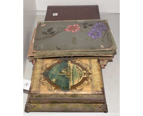 A Victorian musical photograph album, playing two airs, of footstool form, raised on four ball feet, 28 x 23cms; together wit