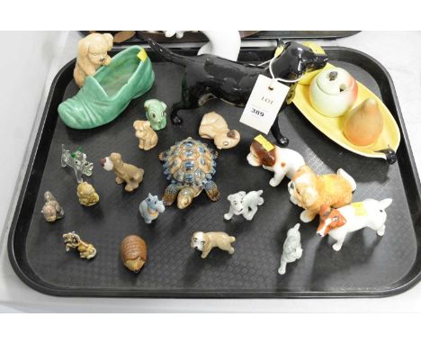 A selection of ceramic and other animal figures, including: a Beswick figure of a black labrador; a Sylvac figure of a dog in