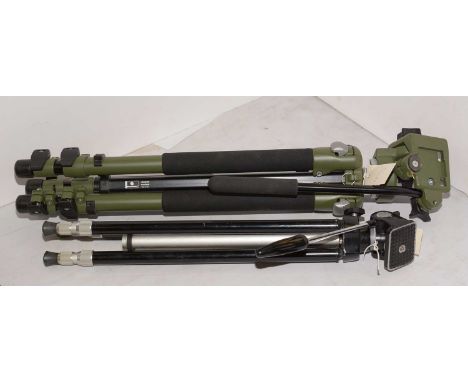 A Manfrotto tripod camera stand in green and black; together with another tripod camera stand.  (2)
