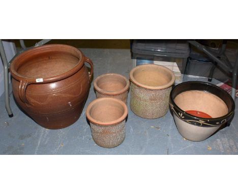 A large brown glazed stoneware garden planter; together with a stoneware garden planter with green glazed border; and a gradu