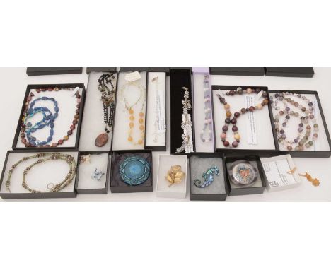 A large selection of costume jewellery, including: stone necklaces, gilt metal brooches, enamel jewellery and other craft ite