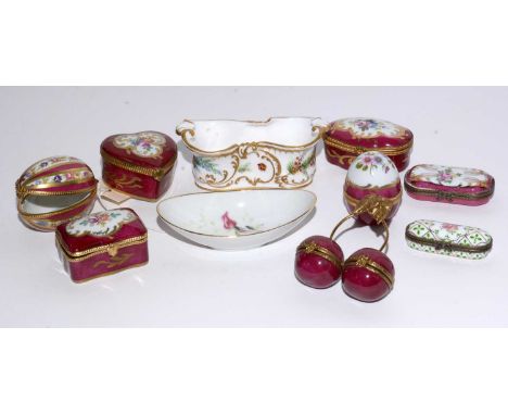 A selection of Continental ceramic pill boxes and pin dishes, including: a Royal Crown Derby trough dish, decorated with butt