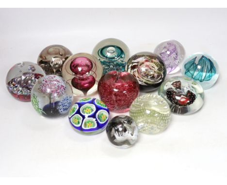 Thirteen glass paperweights including Caithness and Murano, largest 9cm in diameter